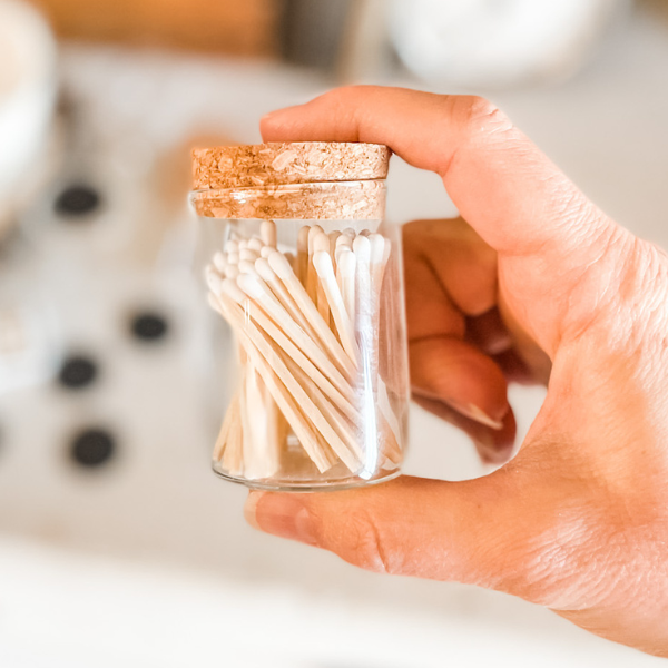 glass jar of matches with cork lid