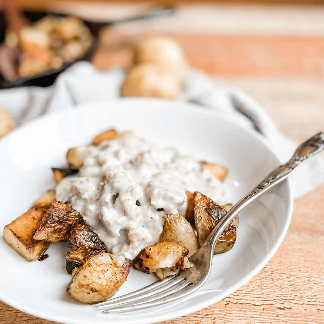 Paleo Sausage Gravy over Crispy Potatoes | Roots & Boots